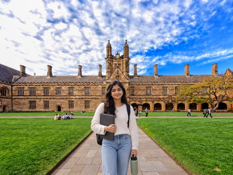 Indian business student in front of the University of Sydney quadrangle